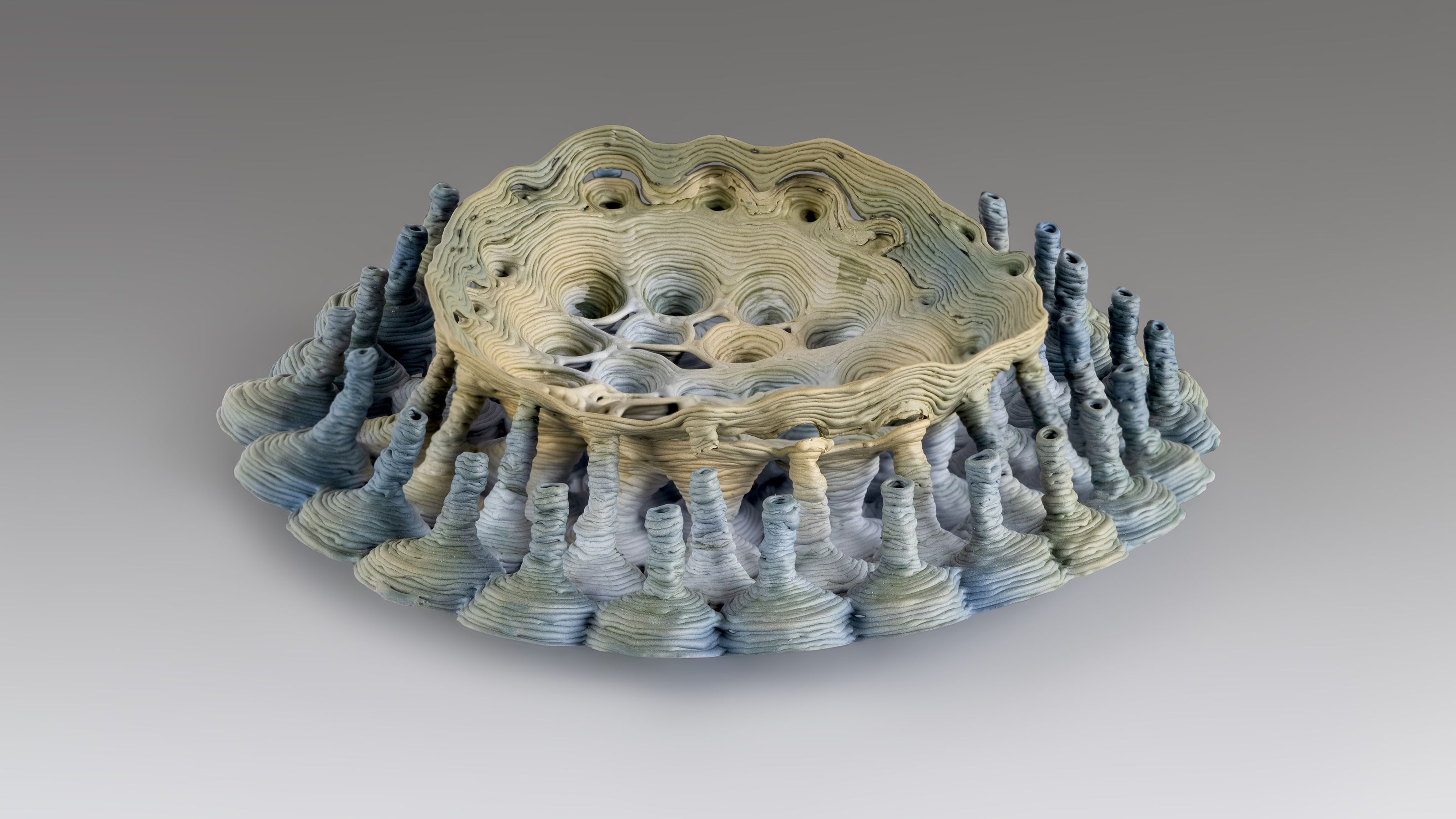 Art work in clay with yellow and blue tones