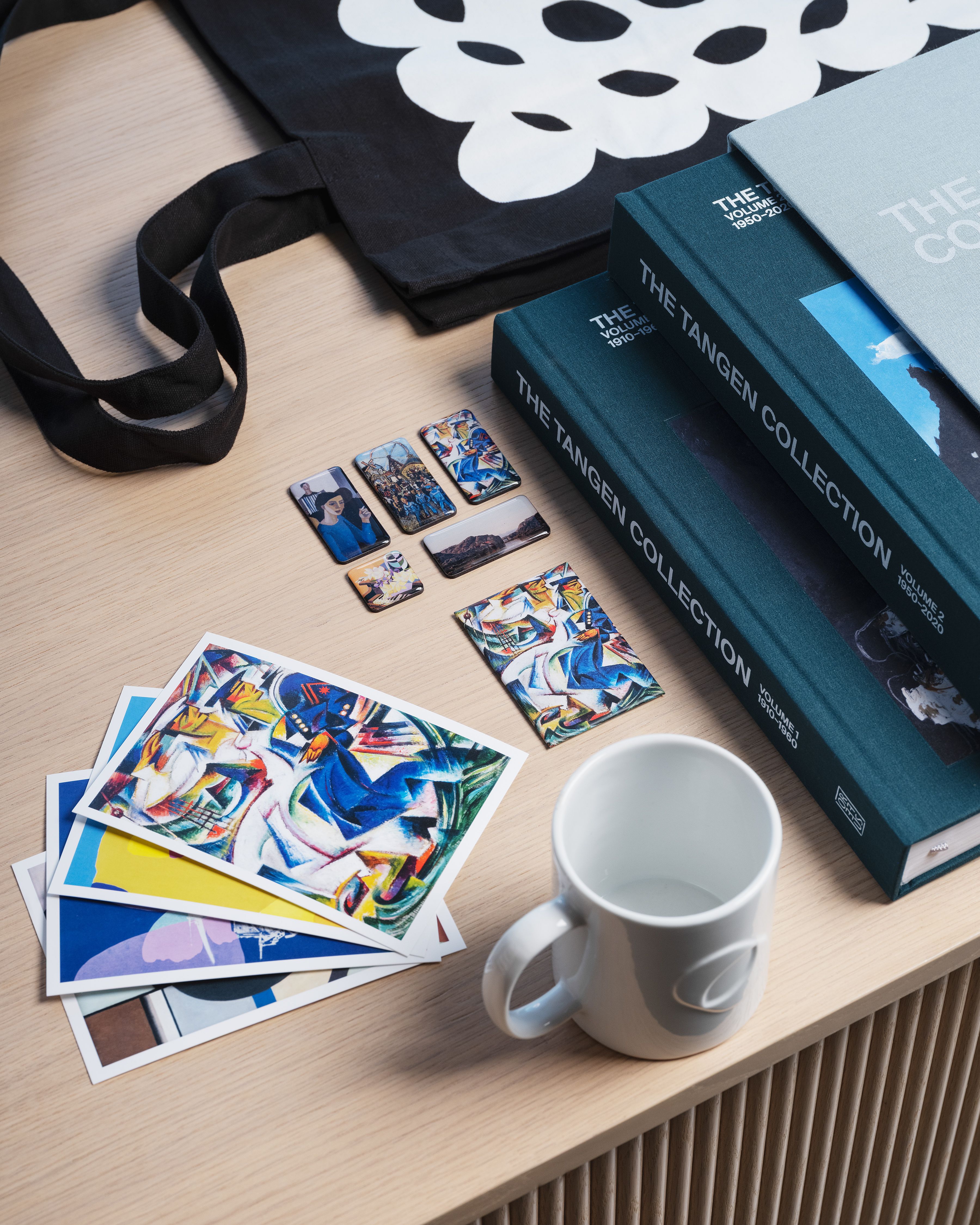 postcards, mug and books