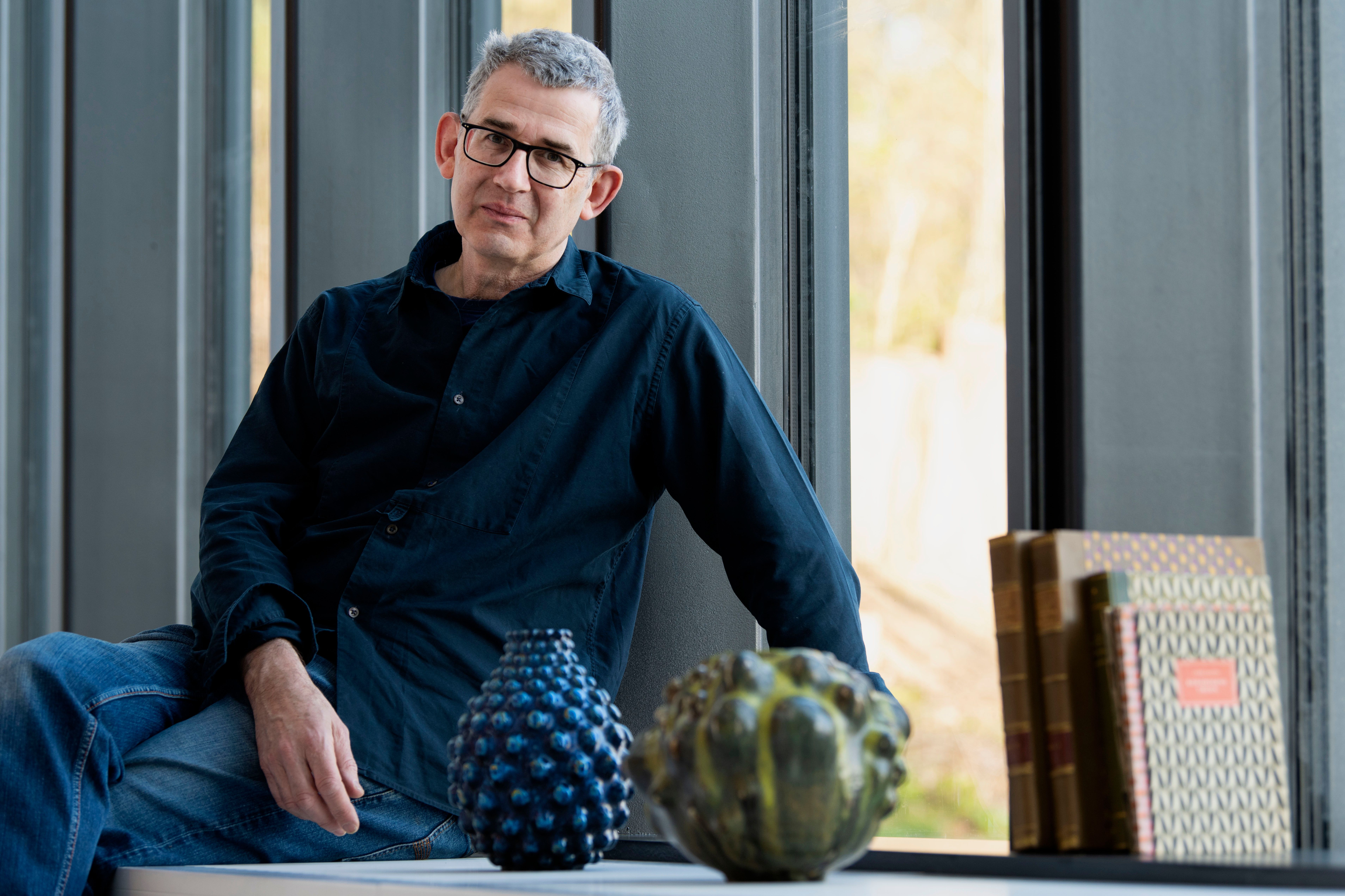 Edmund de Waal surrounded by Axel Salto’s work at CLAY Museum of Ceramic Art Denmark. Photo by Peter Leth-Larsen © Axel Salto/VISDA